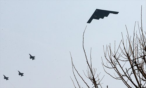 A US B-2 stealth bomber (right) flies over a US air base in Pyeongtaek, south of Seoul. Two nuclear-capable US B-2 stealth bombers flew what the US military described as “deterrence” missions over South Korea on Thursday, as part of the South Korea-US joint military exercise (see story on page 2). Photo: AFP