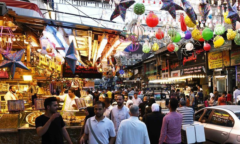 People do shopping in market for Eid al-Fitr in Damascus, Syria - Global Times