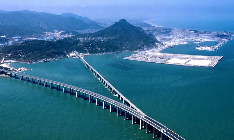 An aerial photo shows the Pingtan Strait Road-rail Bridge in East China’s Fujian Province. The first of its kind in China, the bridge opened on Saturday, shortening travel time between the provincial capital of Fuzhou with the island county of Pingtan to 35 minutes from around two hours. The bridge will make it more convenient for compatriots in the island of Taiwan to travel to the Chinese mainland. Photo: cnsphoto
