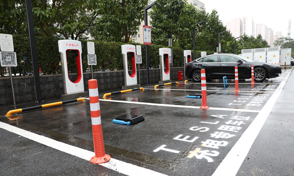A Tesla Model 3 is charged in Haikou, capital of South China’s Hainan Province on Wednesday. The US electric carmaker said it has completed four charging stations in the city and that it planned to cover each county and city in the tropical resort island by October. The company reportedly sold 120,000 vehicles in China in 2020. Photo: VCG