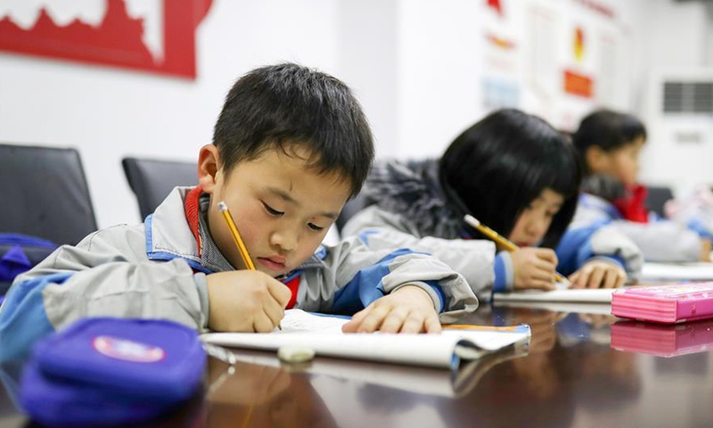 Primary students do homework at an after-school care center in Yuping Dong autonomous county in Southwest China's Guizhou province, Feb 27, 2019.Photo:Xinhua
