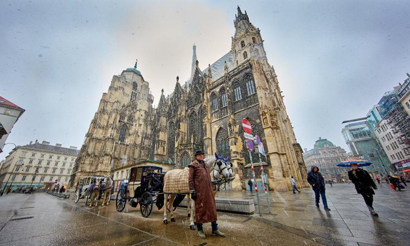 Fiaker horse carriages are seen at the Stephansplatz square in Vienna, Austria, March 19, 2021. Viennese Fiaker coachmen have set up a feed box in the city center, where animal lovers can donate fruit and vegetables for the horses. As one of the most famous tourism projects of Vienna, Fiaker horse carriages encountered operational difficulties during the COVID-19 pandemic. Photo:Xinhua