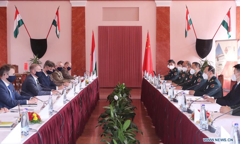 Hungarian Defense Minister Tibor Benko (2nd L) meets with visiting Chinese State Councilor and Minister of National Defense Wei Fenghe (2nd R) in Budapest, Hungary, March 25, 2021.Photo:Xinhua
