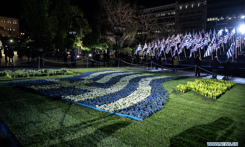 Photo taken on March 24, 2021 shows a Greek flag made by flowers at Syntagma square in Athens, Greece. Greece marked on Thursday the bicentennial of the start of the Greek War of Independence against Ottoman rule with a grand military parade in the center of Athens.Photo:Xinhua