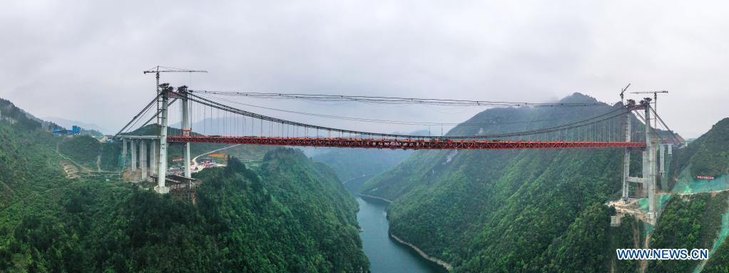 Aerial panoramic photo taken on March 27, 2021 shows the construction site of the Yangbaoshan grand bridge in Guiding County, southwest China's Guizhou Province. With a main span of 650 meters, the grand bridge, which is a part of the Guiyang-Huangping Highway, stretches 1,112 meters in length.  Photo: Xinhua