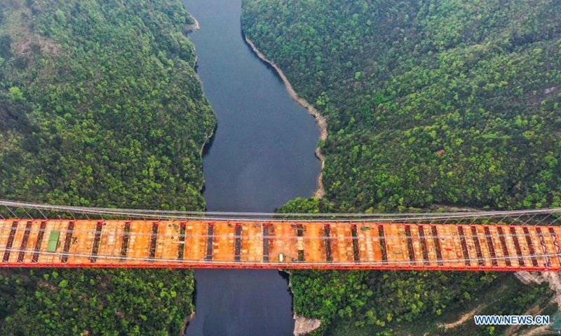 Aerial photo taken on March 27, 2021 shows the construction site of the Yangbaoshan grand bridge in Guiding County, southwest China's Guizhou Province. With a main span of 650 meters, the grand bridge, which is a part of the Guiyang-Huangping Highway, stretches 1,112 meters in length.   Photo: Xinhua