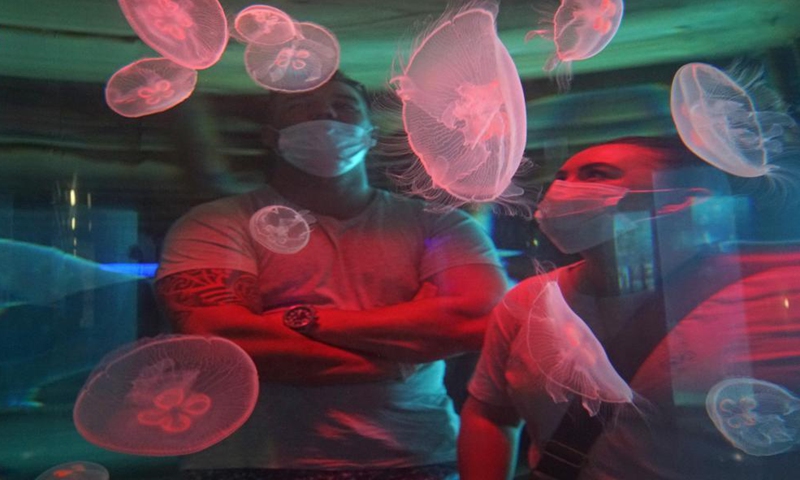 Tourists visit the USHAKA Marine World in Durban, South Africa, April 1, 2021.