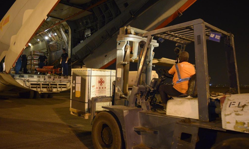 Chinese vaccines are unloaded from a plane at the Khartoum International Airport in Khartoum, Sudan, March 26, 2021. A batch of China's Sinopharm COVID-19 vaccines, donated by the Chinese government to Sudan, arrived here on Friday.Photo:Xinhua