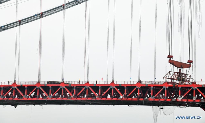 Photo taken on March 27, 2021 shows the construction site of the Yangbaoshan grand bridge in Guiding County, southwest China's Guizhou Province. With a main span of 650 meters, the grand bridge, which is a part of the Guiyang-Huangping Highway, stretches 1,112 meters in length.  Photo: Xinhua