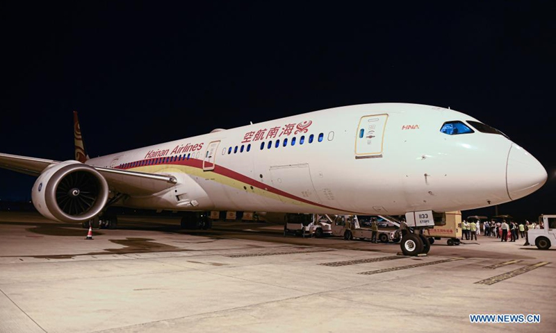 A cargo flight of Hainan Airlines is seen at Haikou Meilan International Airport in Haikou, south China's Hainan Province, March 26, 2021. China's southern tropical province of Hainan on Saturday launched a Haikou-Paris air freight route to serve international cargo transport of its free trade port. An outbound cargo flight carrying 35 tonnes of goods left Haikou for Paris on Saturday morning. Photo: Xinhua