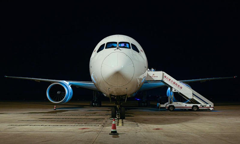 A cargo flight of Hainan Airlines is seen at Haikou Meilan International Airport in Haikou, south China's Hainan Province, in the early morning on March 27, 2021. China's southern tropical province of Hainan on Saturday launched a Haikou-Paris air freight route to serve international cargo transport of its free trade port. An outbound cargo flight carrying 35 tonnes of goods left Haikou for Paris on Saturday morning. Photo: Xinhua