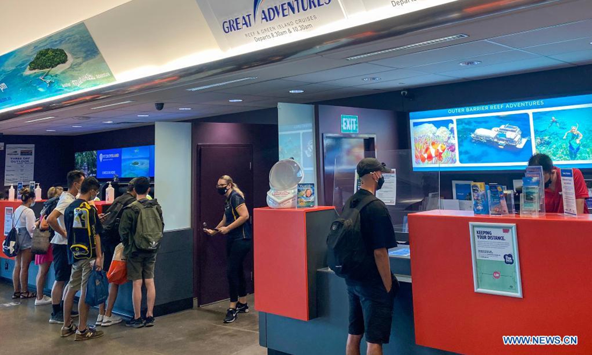 Tourists visit Reef Fleet Terminal in Cairns, Queensland, Australia, on April 2, 2021. There were some restrictions remaining in place across Queensland until April 15, including mandatory face masks in indoor venues except home. (Xinhua/Bai Xuefei)