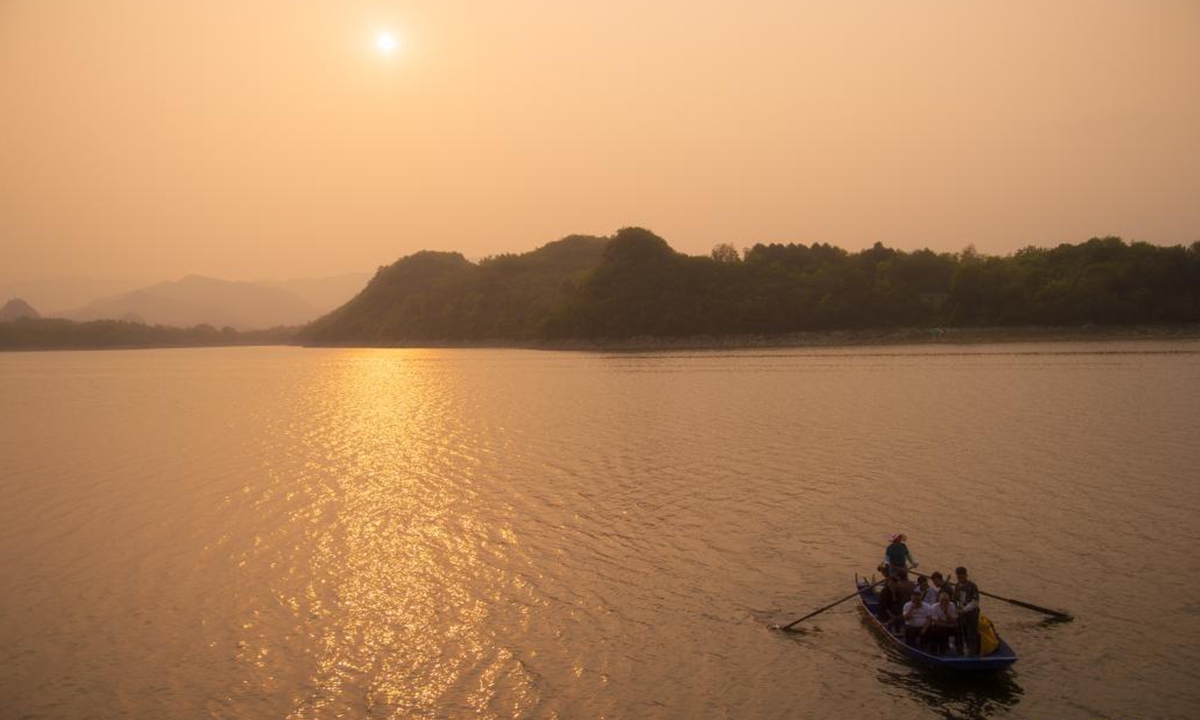 Aerial photo taken on April 2, 2021 shows a view of the Baihua Lake at dusk in Guiyang, southwest China's Guizhou Province. (Xinhua/Liu Xu)