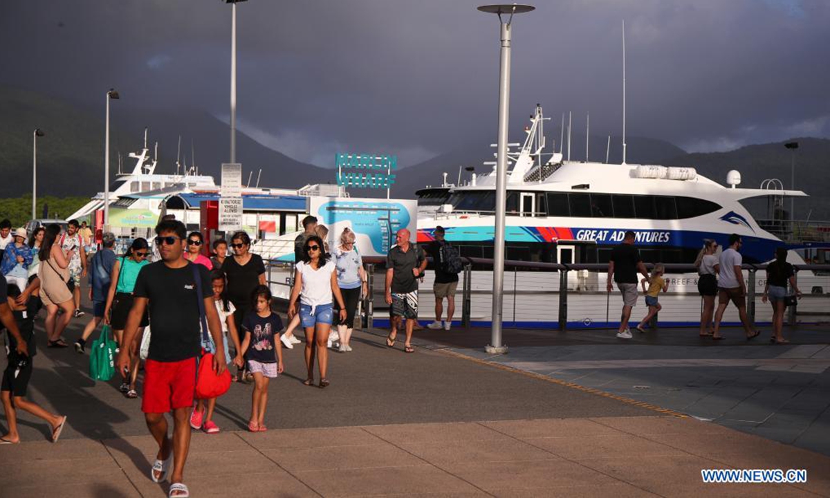 Tourists visit Reef Fleet Terminal in Cairns, Queensland, Australia, on April 2, 2021. There were some restrictions remaining in place across Queensland until April 15, including mandatory face masks in indoor venues except home. (Xinhua/Bai Xuefei)