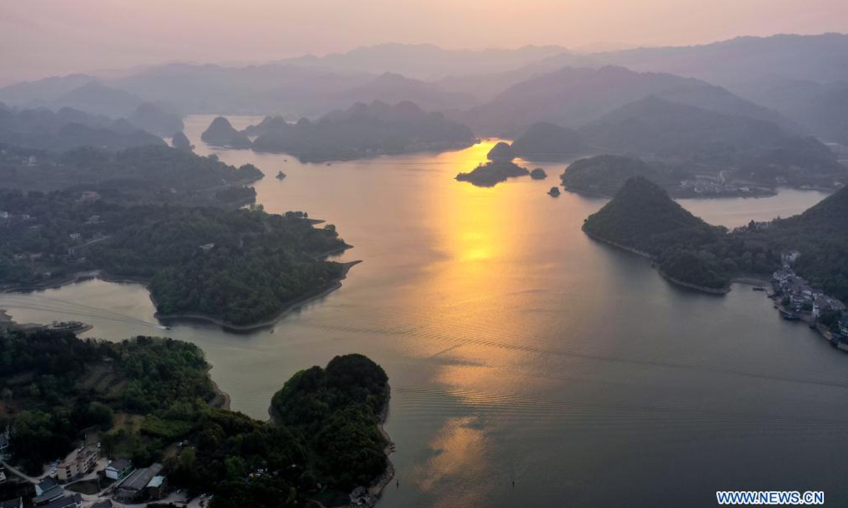 Aerial photo taken on April 2, 2021 shows a view of the Baihua Lake at dusk in Guiyang, southwest China's Guizhou Province. (Xinhua/Liu Xu)