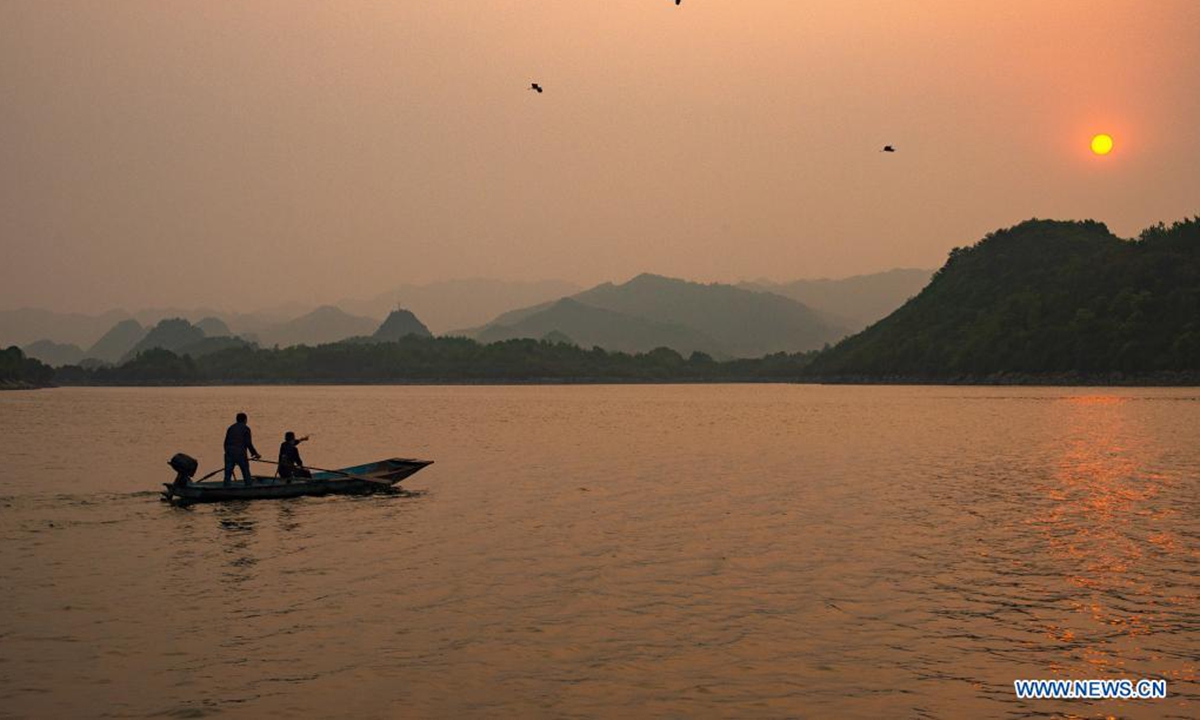 Aerial photo taken on April 2, 2021 shows a view of the Baihua Lake at dusk in Guiyang, southwest China's Guizhou Province. (Xinhua/Liu Xu)