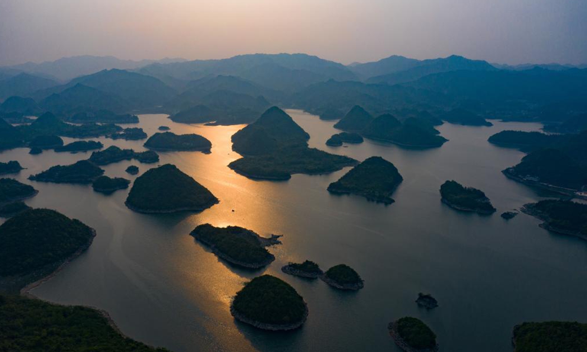 Aerial photo taken on April 2, 2021 shows a view of the Baihua Lake at dusk in Guiyang, southwest China's Guizhou Province. (Xinhua/Liu Xu)