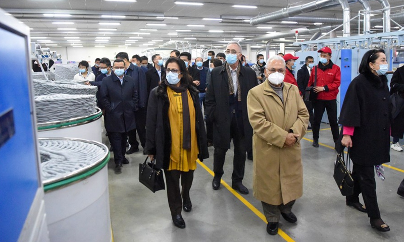 Foreign diplomats visit a textile enterprise in northwest China's Xinjiang Uygur Autonomous Region, April 1, 2021. From March 30 to April 2, a delegation comprising Vladimir Norov, secretary-general of the Shanghai Cooperation Organization (SCO), and more than 30 diplomats from some 21 countries visited Xinjiang.Photo:Xinhua