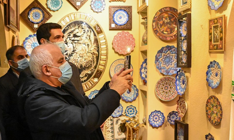 Foreign diplomats visit the International Grand Bazaar in Urumqi, northwest China's Xinjiang Uygur Autonomous Region, March 30, 2021. From March 30 to April 2, a delegation comprising Vladimir Norov, secretary-general of the Shanghai Cooperation Organization (SCO), and more than 30 diplomats from some 21 countries visited Xinjiang.Photo:Xinhua