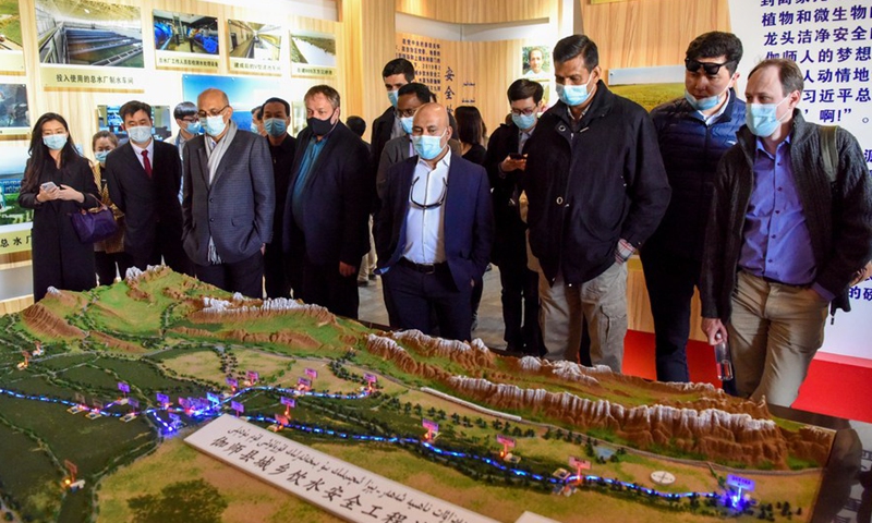 Foreign diplomats visit a rural water supply station in Payzawat County, northwest China's Xinjiang Uygur Autonomous Region, March 31, 2021. From March 30 to April 2, a delegation comprising Vladimir Norov, secretary-general of the Shanghai Cooperation Organization (SCO), and more than 30 diplomats from some 21 countries visited Xinjiang. Photo:Xinhua