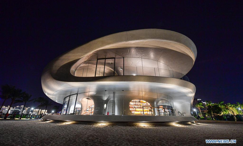 Photo taken on April 12, 2021 shows the Wormhole Library in the Haikou Bay in Haikou, capital city of south China's Hainan Province. The Wormhole Library, designed as a landmark building in the Haikou Bay, opened to public on Tuesday.(Photo: Xinhua)