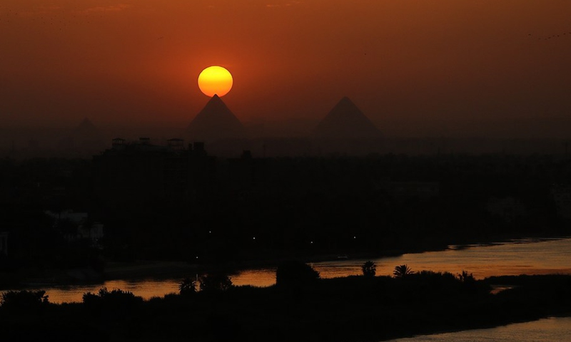 Photo taken on April 14, 2021 shows the pyramids at sunset in Cairo, Egypt.(Photo: Xinhua)
