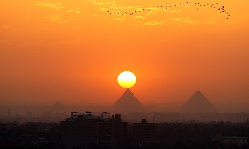 Photo taken on April 14, 2021 shows the pyramids at sunset in Cairo, Egypt.(Photo: Xinhua)
