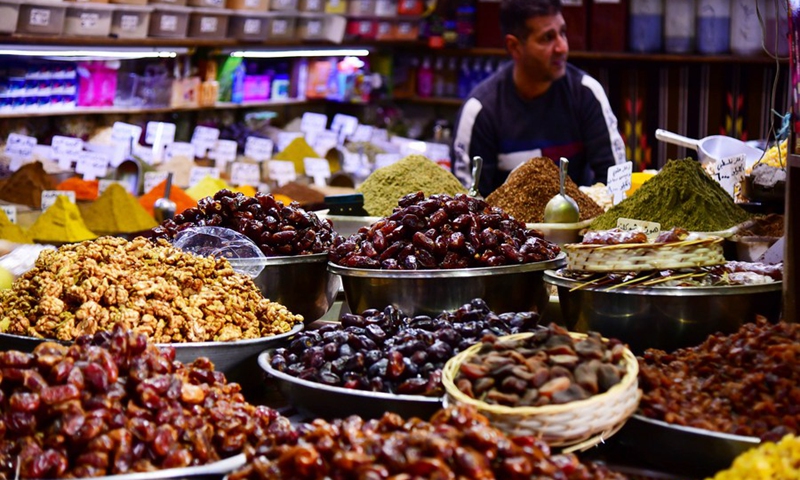 A stall selling dried fruits and dates is seen on the first day of Ramadan in Damascus, Syria, on April 13, 2021.(Photo: Xinhua)