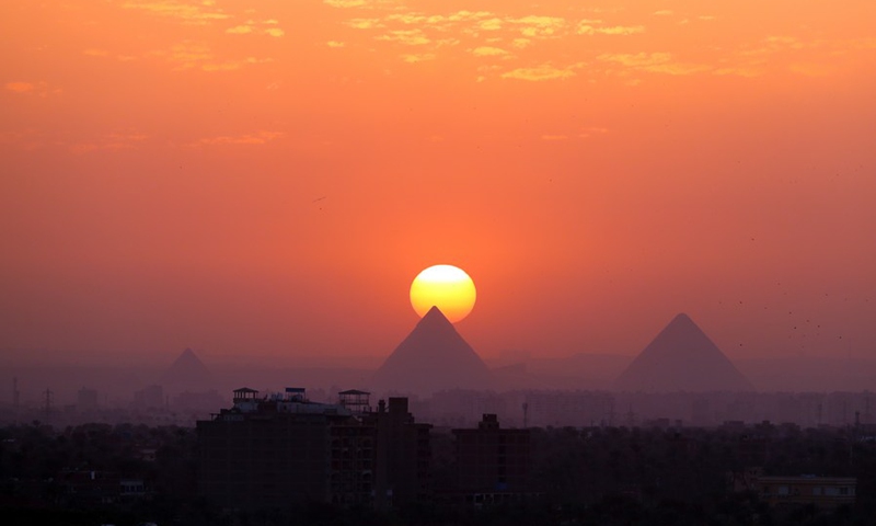 Photo taken on April 14, 2021 shows the pyramids at sunset in Cairo, Egypt.(Photo: Xinhua)