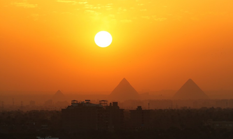 Photo taken on April 14, 2021 shows the pyramids at sunset in Cairo, Egypt.(Photo: Xinhua)