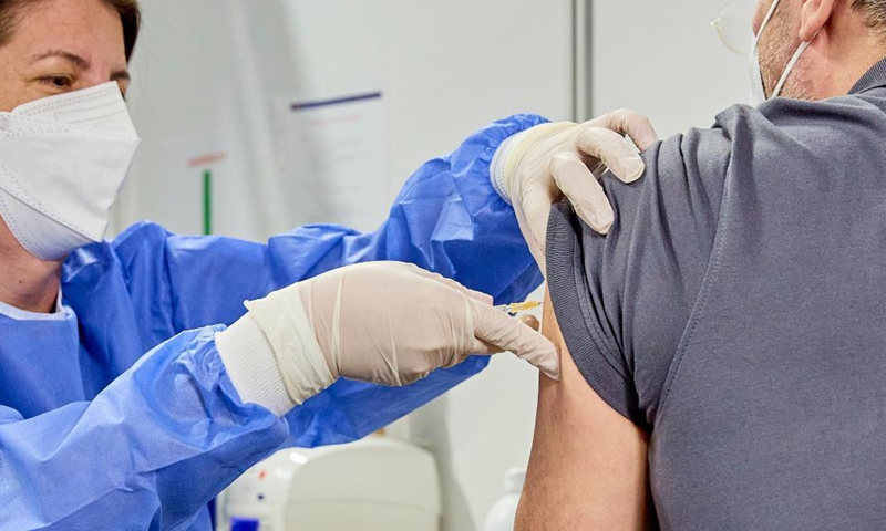 A man receives a dose of COVID-19 vaccine inside Austria's largest vaccination site at the Austria Center in Vienna, Austria, on April 16, 2021.Photo:Xinhua