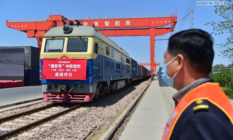 A freight train bound for Hamburg, Germany is ready to depart at the Shijiazhuang international land port in north China's Hebei Province, on April 17, 2021. The first China-Europe freight train bound for Germany from Hebei Province set out on Saturday in Shijiazhuang. The train, loaded with 100 twenty-foot equivalent unit (TEU) of cargo, is expected to arrive in Hamburg in 18 days.(Photo: Xinhua)
