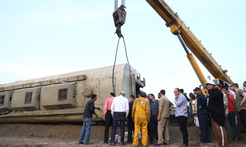 Rescuers work at the site of a train derailment in Toukh, Egypt, on April 18, 2021.(Photo: Xinhua)