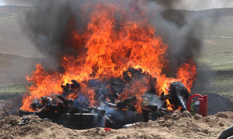 Smoke rises from burning drugs in Sari Pul province, Afghanistan on April 17, 2021. The Afghan authorities burned about one ton of seized narcotic drugs in Sari Pul province, Afghanistan, a local official said on Saturday.(Photo: Xinhua)