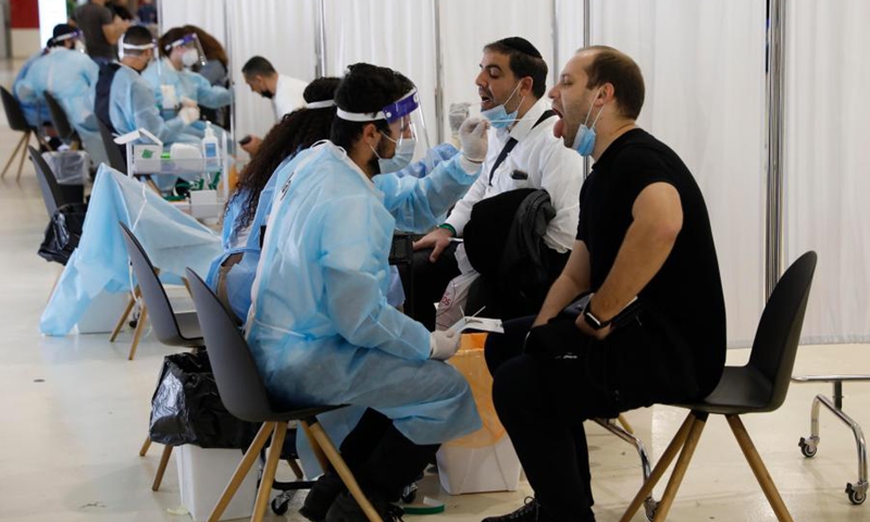 Travelers receive COVID-19 tests upon their arrival at Ben Gurion International Airport near Tel Aviv, Israel, on March 21, 2021. (Photo: Xinhua)
