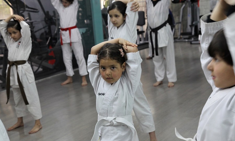 A member of Palestinian Bsharat family practices karate at a local gymnasium in the West Bank city of Nablus, on April 4, 2021.(Photo: Xinhua)