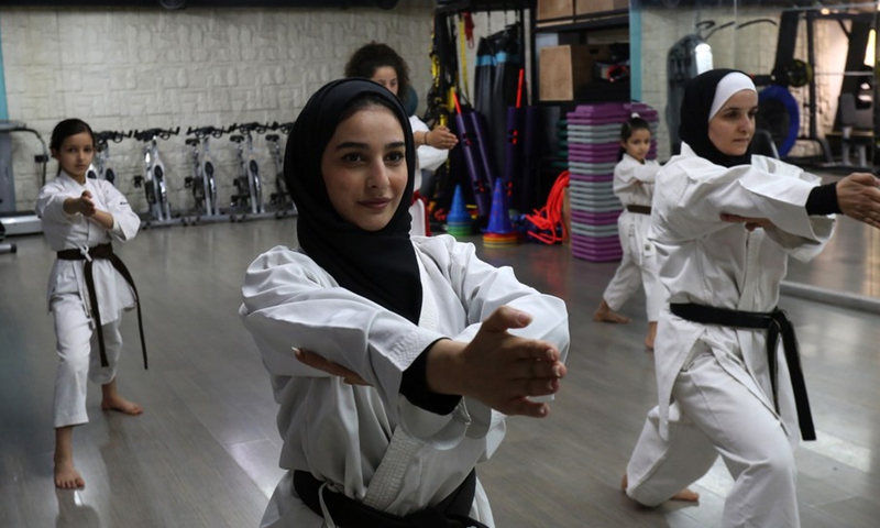 Members of Palestinian Bsharat family practice karate at a local gymnasium in the West Bank city of Nablus, on April 4, 2021.(Photo: Xinhua)