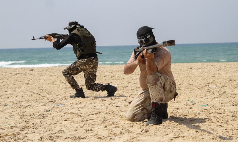 Palestinian militants of the Al-Mujahideen Brigades take part in an anti-Israel military drill in Gaza City, on April 24, 2021. (Photo: Xinhua)