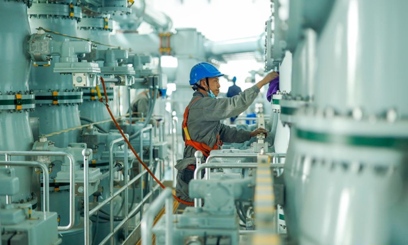 A staff member works at the 500-KV Jinshan electricity substation in southwest China's Chongqing, April 27, 2021. The 500-KV Jinshan electricity substation was officially put into operation on Friday, which is expected to greatly improve the power supply in the northern area of Chongqing.Photo:Xinhua
