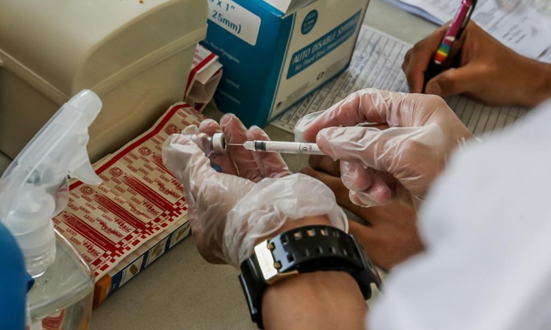 A health worker prepares a dose of the Sinovac COVID-19 vaccine in Manila, the Philippines on May 1, 2021.Photo:Xinhua