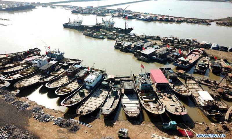 Aerial photo taken on April 30, 2021 shows fishing vessels berthed at a port in Ganyu District of Lianyungang, east China's Jiangsu Province. The annual summer fishing ban, covering the Bohai Sea, the Yellow Sea, the East China Sea, and the waters north to 12 degrees north latitude of the South China Sea, started Saturday.Photo:Xinhua