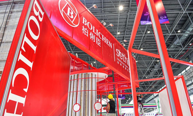Workers prepare the venue for the first China International Consumer Products Expo at the Hainan International Convention and Exhibition Center in Haikou, south China's Hainan Province, May 1, 2021. The first China International Consumer Products Expo is set to be staged from May 7 to 10. Photo: Xinhua