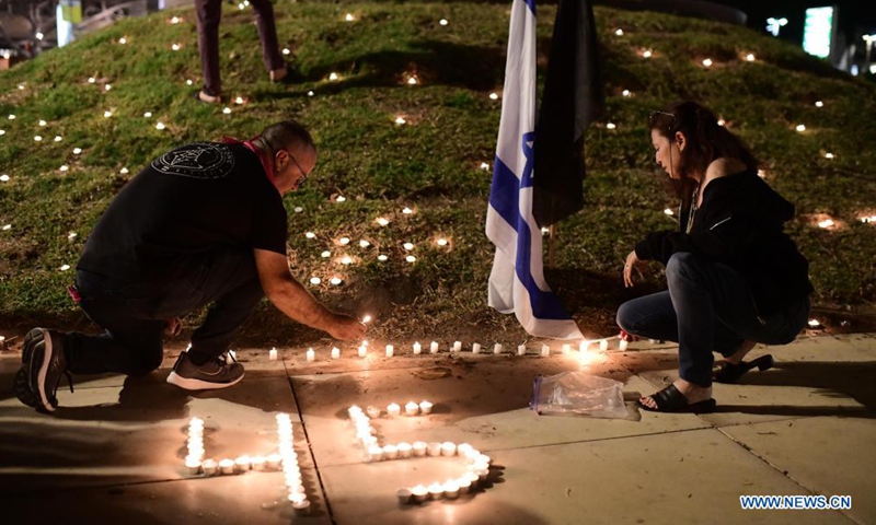 Israelis light candles for the 45 victims killed in a stampede which took place during a festival celebrated on the eve of the Jewish holiday Lag BaOmer, at Habima Square in Tel Aviv, Israel, on May 1, 2021. Israeli Prime Minister Benjamin Netanyahu declared Sunday as a national day of mourning following the disaster on Thursday night. (Tomer Neuberg/JINI via Xinhua)