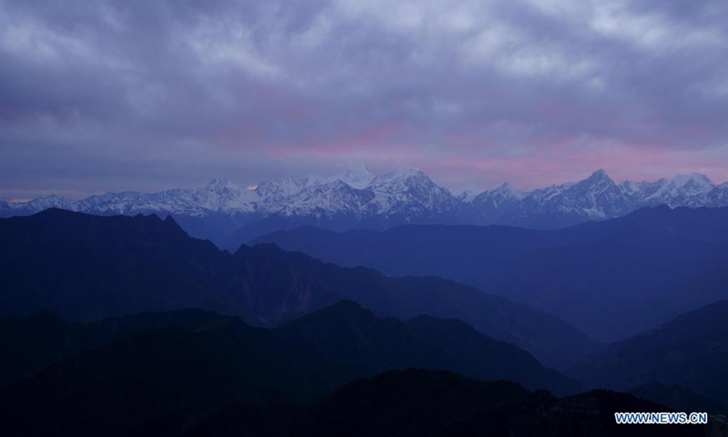 Photo taken on May 1, 2021 shows Gongga Mountain seen from the top of the Niubei Mountain in southwest China's Sichuan Province. The Niubei Mountain, with an altitude of 3,600 meters, spans from Yingjing County to Luding County in southwest China's Sichuan. There is a scenic area on its top under construction, with a sightseeing platform, a parking lot, a wooden house hotel and a tent hotel. (Xinhua/Jiang Hongjing)