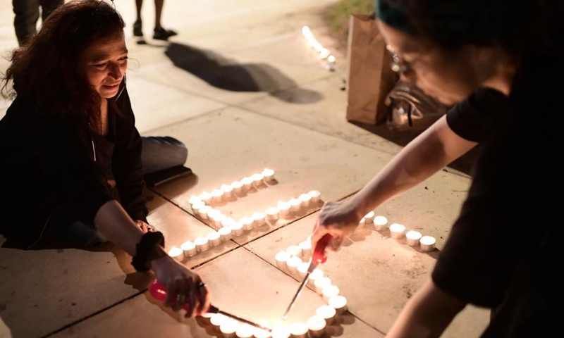 Israelis light candles for the 45 victims killed in a stampede which took place during a festival celebrated on the eve of the Jewish holiday Lag BaOmer, at Habima Square in Tel Aviv, Israel, on May 1, 2021. Israeli Prime Minister Benjamin Netanyahu declared Sunday as a national day of mourning following the disaster on Thursday night. (Tomer Neuberg/JINI via Xinhua)