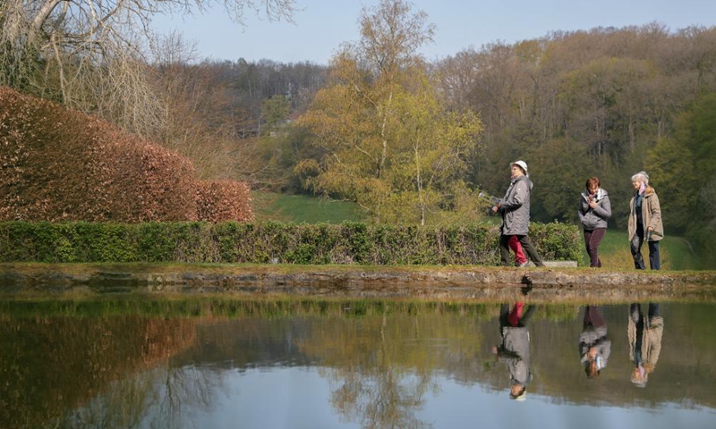 Tourists visit the Water Gardens of Annevoie in Annevoie-Rouillon, Namur, Belgium, May 1, 2021. Photo: Xinhua