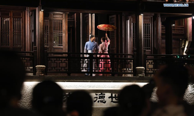 Visitors watch a night performance in Yanzhou ancient city in Meicheng Township, Jiande City of east China's Zhejiang Province, on May 2, 2021. The ancient city received a total of 114,000 visitors on Saturday and Sunday. (Xinhua/Xu Yu)