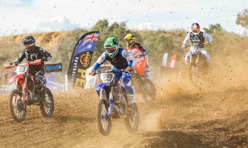 Riders compete during the second round of the 2021 Australian Motocross Championship in Canberra, Australia, May 2, 2021 (Photo by Chu Chen/Xinhua)