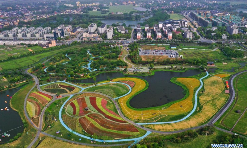 Aerial photo taken on May 2, 2021 shows flower fields in Jingshan Township of Yuhang District in Hangzhou, capital of east China's Zhejiang Province. From May 1 to May 5, an animation carnival is held at the flower fields at the Jingshan Town of Yuhang District of Hangzhou. (Xinhua/Xu Yu)