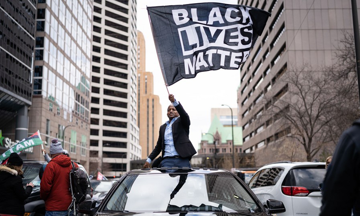 A man celebrates outside the Hennepin County Government Center reacting to the trial verdict that former Minneapolis police officer Derek Chauvin was found guilty on all counts in Minneapolis, Minnesota, April 20, 2021. (Photo by Ben Brewer/Xinhua)
